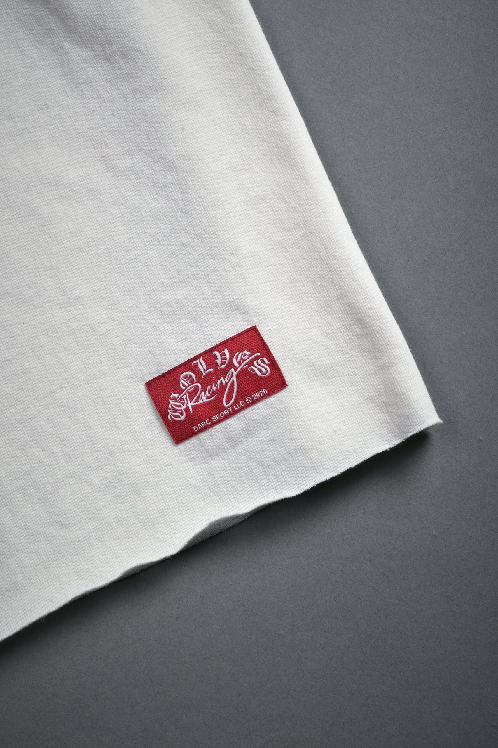 Darc Racer Grunge Mid Length Raw Hem Tee in Cream - Image 5